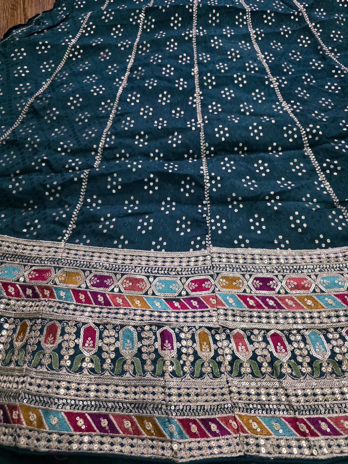 Close up of bottle green semi Stitched Lehenga