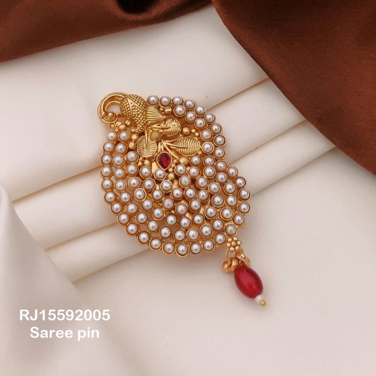 Pearl embellished saree brooch with red bead drop – Indian saree styling accessory