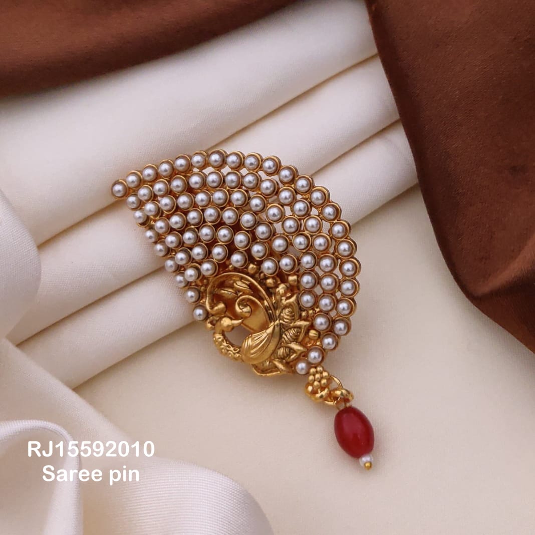 Pearl saree pin brooch with gold motif and red bead drop – traditional Indian saree accessory